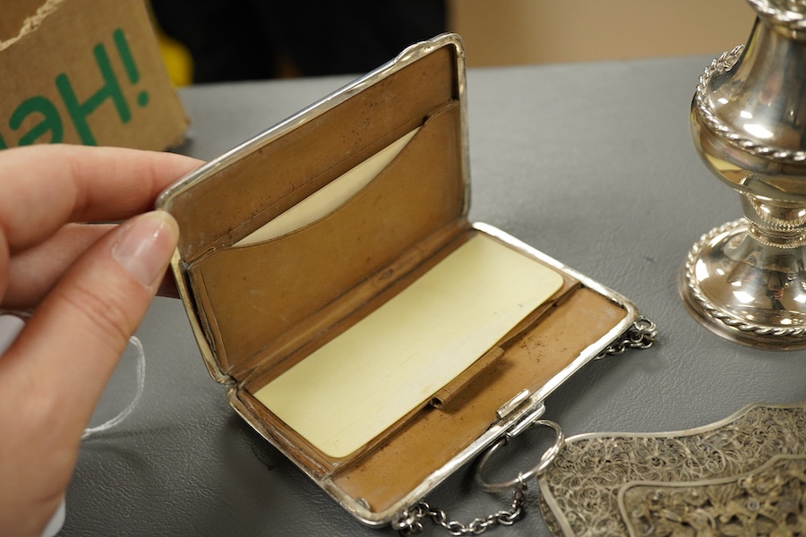 A modern silver pepperette, Birmingham, 1988, 14cm, a silver mustard pot and associated silver spoon, a silver mounted notecase and a filigree white metal card case.